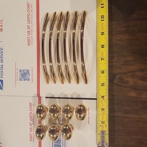 Gold colored drawer handles and knobs